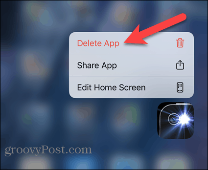 Stuknij Usuń aplikację w menu podręcznym iPhone'a