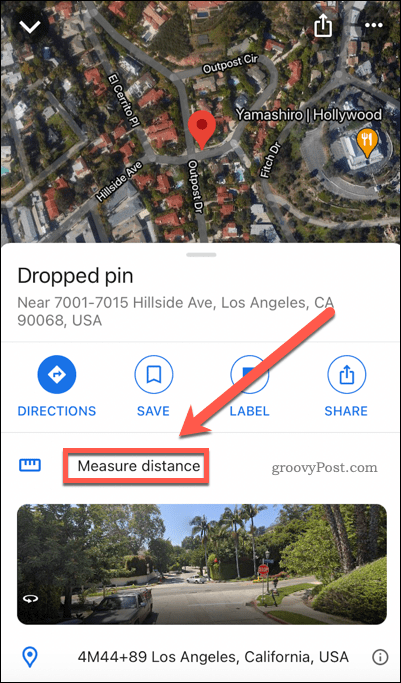 Przycisk pomiaru odległości w Mapach Google na telefonie komórkowym